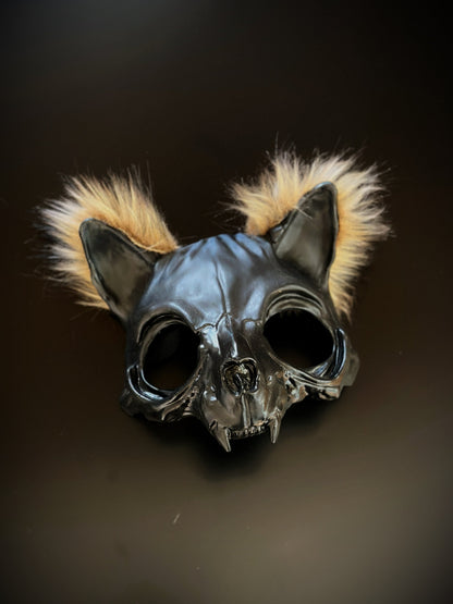 Black cat skull mask with fur tufts, featuring a gothic and eerie design.