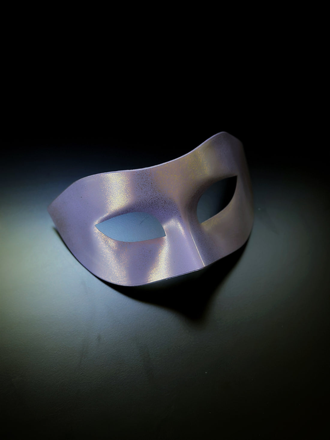 Shimmering purple mask with a sleek metallic finish, designed for masquerade events, theater, and costume parties.

