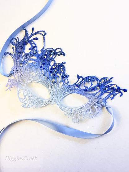 Elegant silver and blue ombré lace masquerade mask with rhinestones, perfect for prom or Venetian ball.
