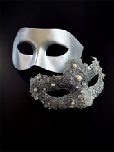 Silver couples masquerade masks with pearl lace detailing on black background