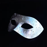 Silver Venetian masquerade mask with embossed filigree design.