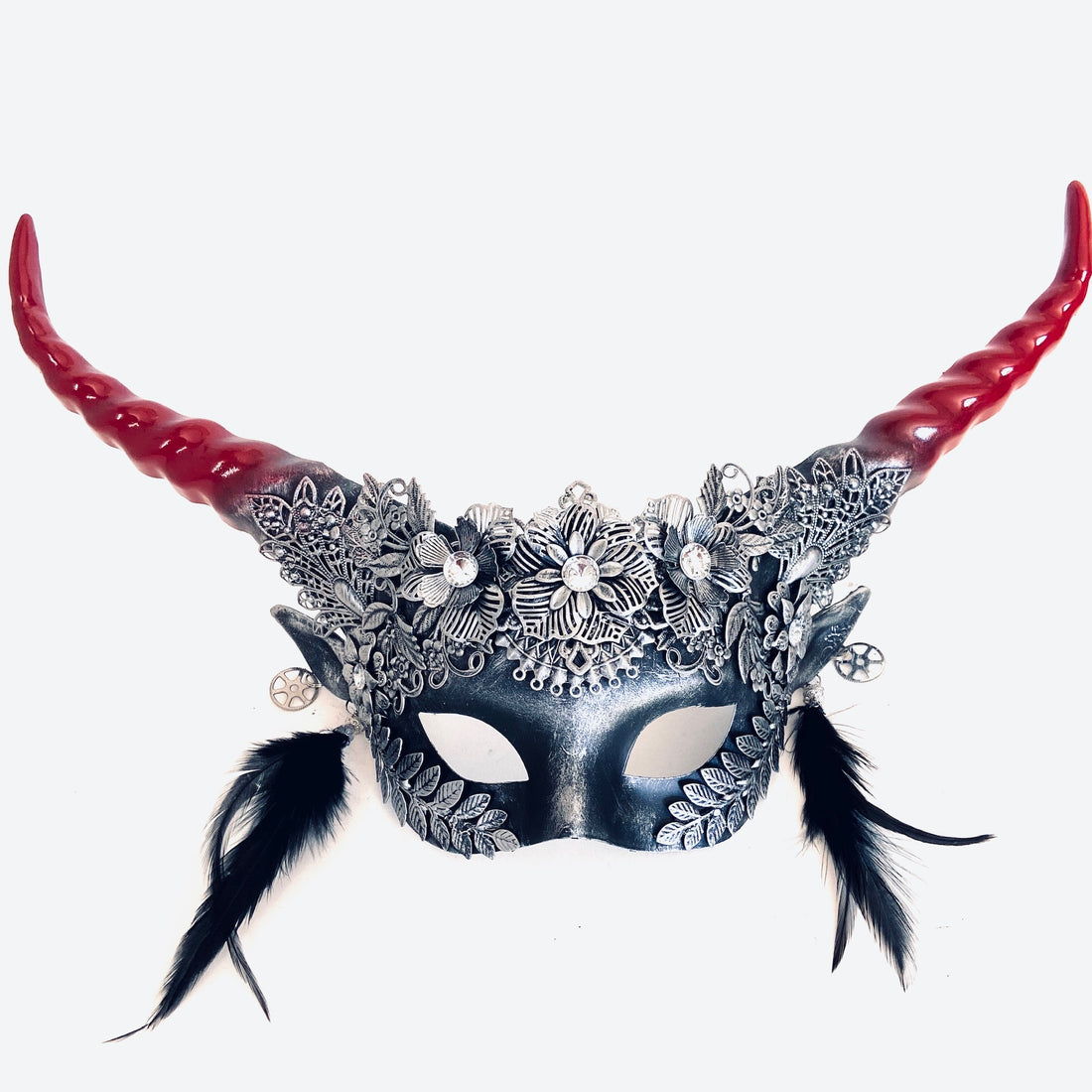 Silver and red gothic floral horn masquerade mask with black feathers.