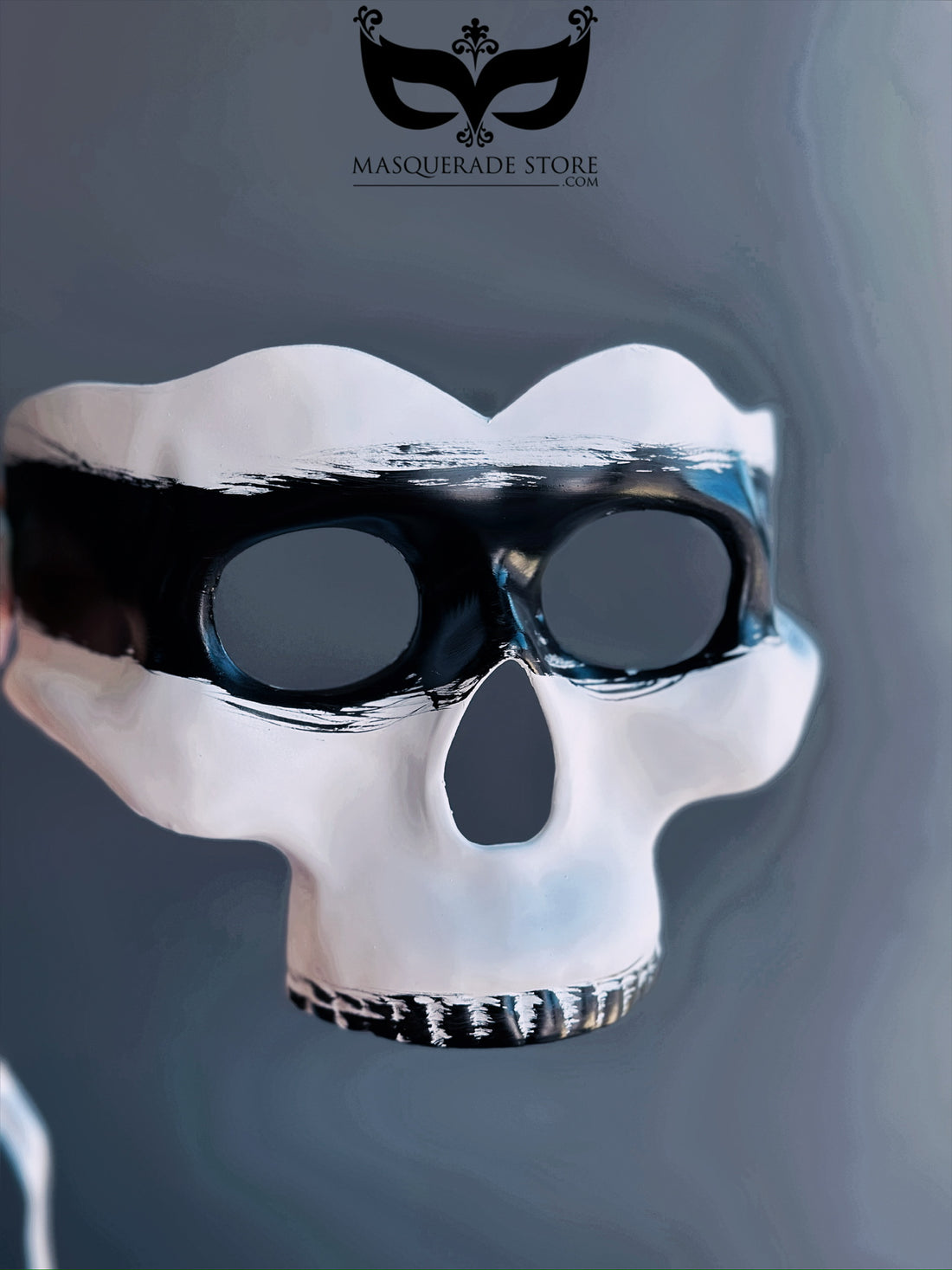 White and black skull masquerade mask with gothic design, perfect for costume parties and Venetian-inspired events.