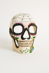 Día de los Muertos sugar skull mask with floral and teeth design.