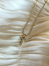 Gold initial T necklace with crystal stones.