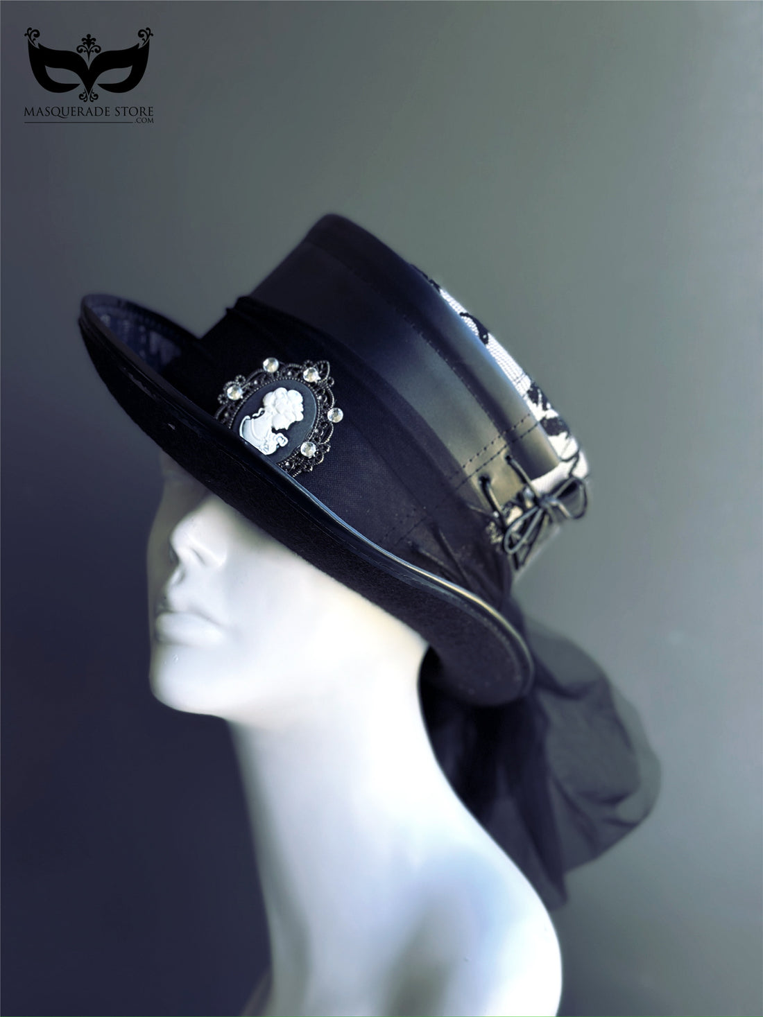 Victorian black lace fascinator hat with cameo brooch, tulle veil, and satin ribbon accents