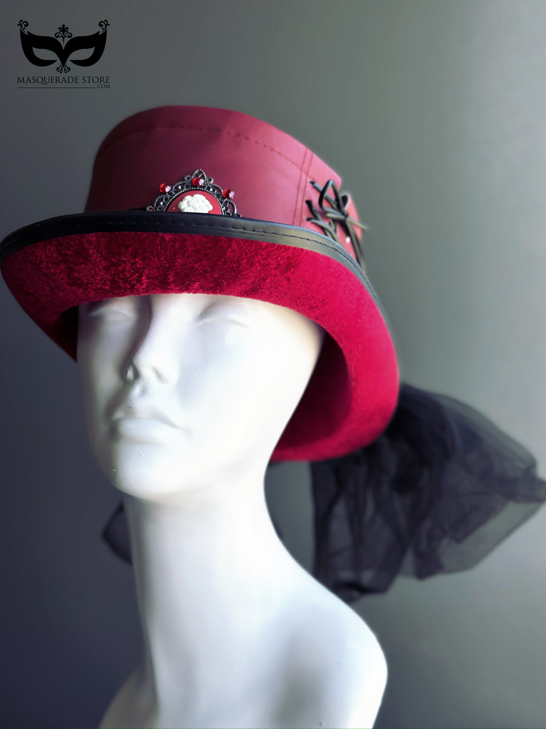 Red Victorian top hat with black velvet brim and cameo brooch for gothic masquerade or steampunk costume