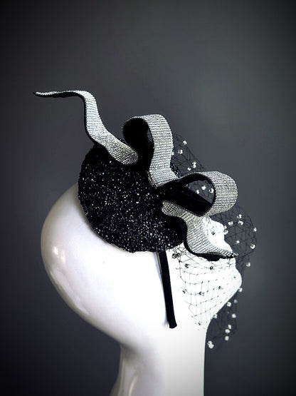 Black rhinestone fascinator hat with dramatic crystal veil and vintage ribbon detail

