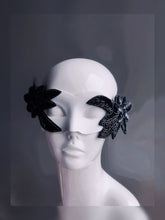 Nocturne Bloom white masquerade mask with black beaded floral accents, perfect for modern masquerade parties.