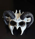 White and black ram horn fantasy masquerade mask with distressed bone-inspired finish, sculpted curved horns, and lightweight polyresin construction for Halloween, cosplay, masquerade balls, gothic events, theatrical performances, and fantasy-themed costumes.