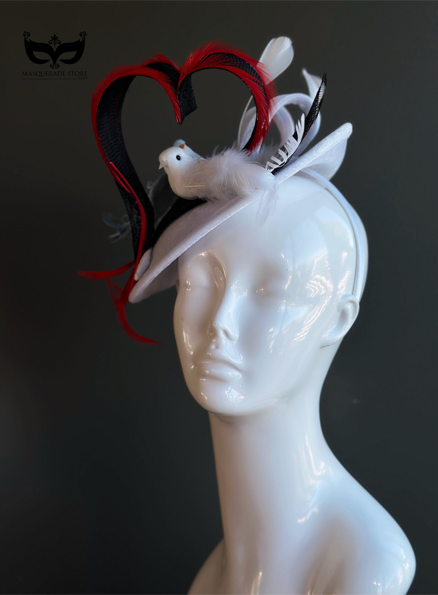 White fascinator hat with heart shape and two decorative birds