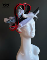 Love birds themed fascinator hat with feathers and red accents
