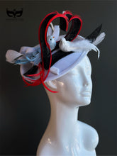 White fascinator hat with heart shape and two decorative birds
