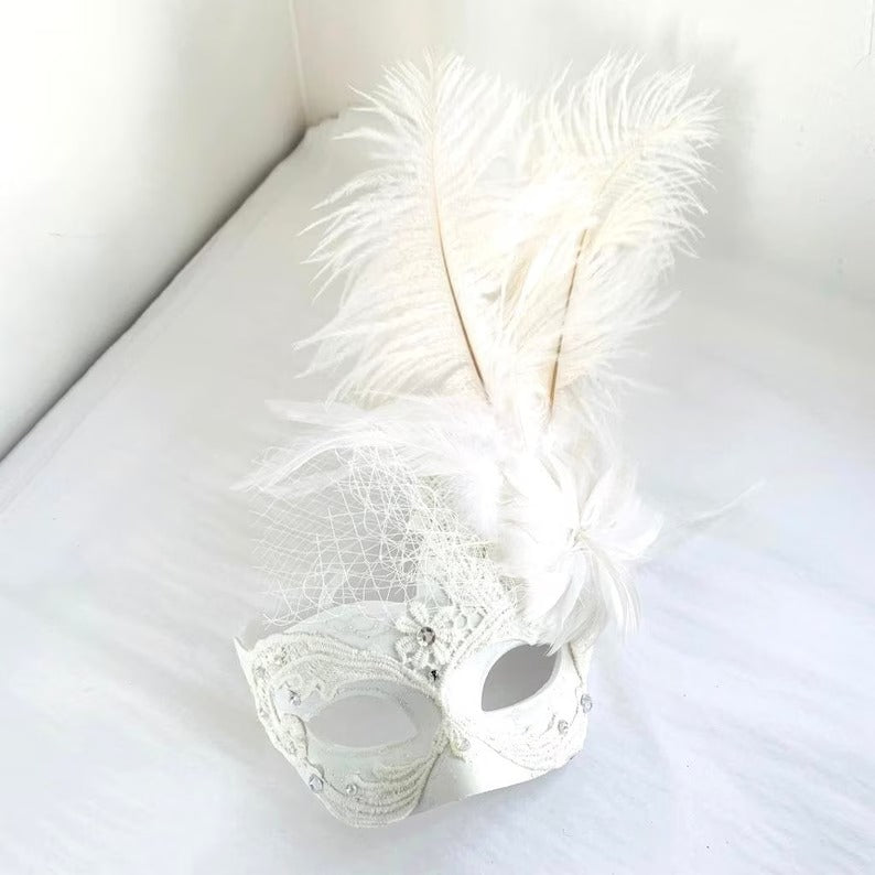 Elegant white masquerade mask with tall feather plume and netting accent, Venetian wedding and prom mask.