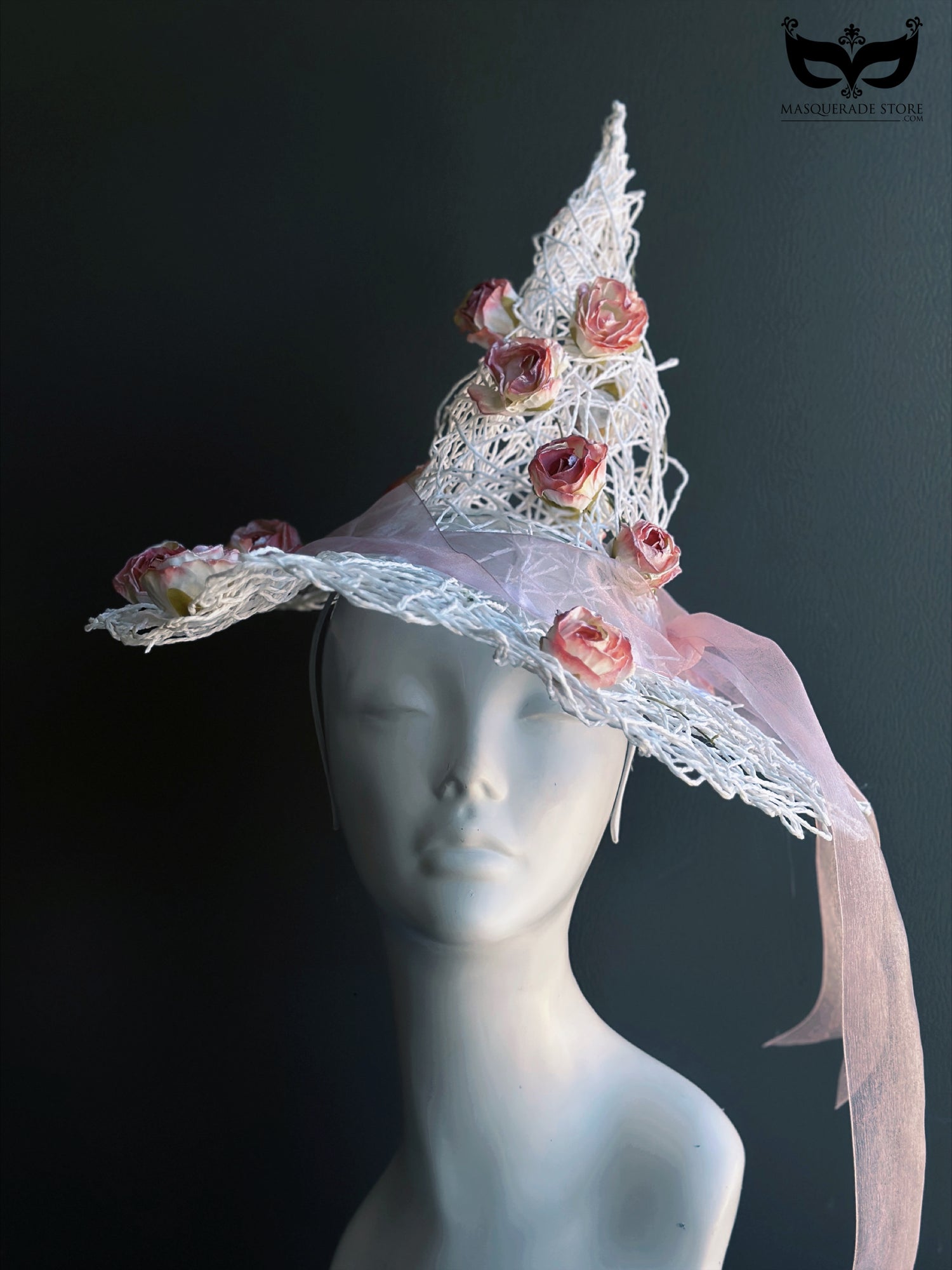 White wire witch hat decorated with pink roses and ribbon for whimsical fairy or Halloween costume looks.
