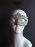 White pearl beaded masquerade mask with rhinestone details and elegant shaping.
