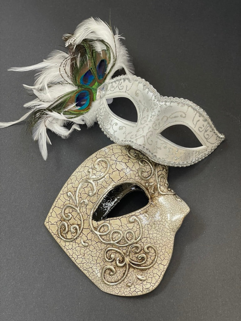 White couples masquerade mask set featuring a feathered peacock Venetian mask for women and an antique ivory phantom mask for men, designed for weddings, masquerade balls, Mardi Gras celebrations, galas, cosplay, and elegant costume events.