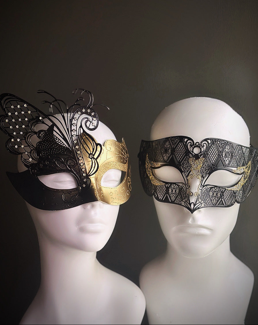 Black and gold masquerade mask set for couples featuring butterfly wings and gold filigree accents