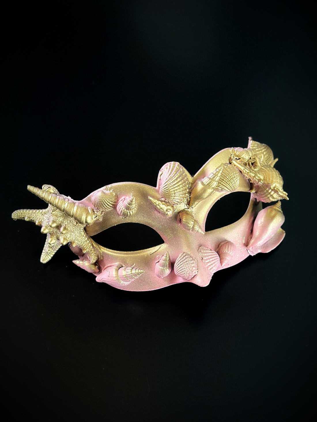 Pink gold masquerade mask with shells and starfish
