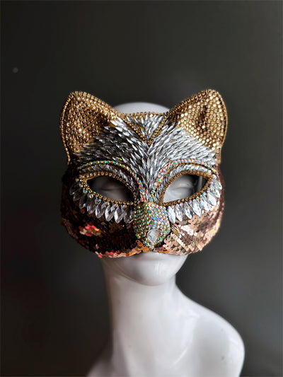 Women's cat masquerade mask covered in rhinestones in gold.