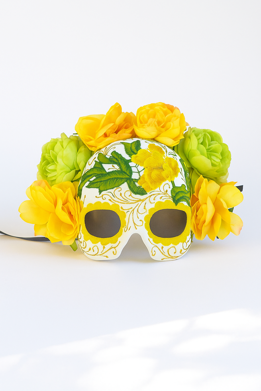 Yellow floral sugar skull mask with embroidered details for Halloween, Day of the Dead, and masquerade events.