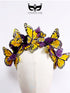 Yellow and purple butterfly headband with layered monarch style wings arranged in a curved crown design