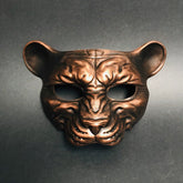 Metallic copper animal face mask with panther shape for jungle or fantasy masquerade events