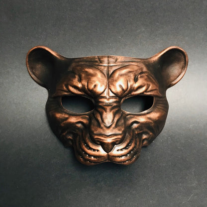 Metallic copper animal face mask with panther shape for jungle or fantasy masquerade events