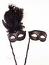 Elegant black couples masquerade masks with feather and Venetian styling

