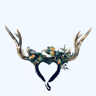 Women's gold deer antler headdress with artificial green forest leaves and moss
