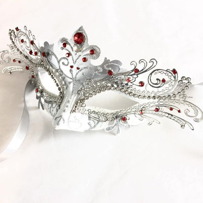 Women's silver and white fox inspired masquerade mask with ruby red rhinestones.