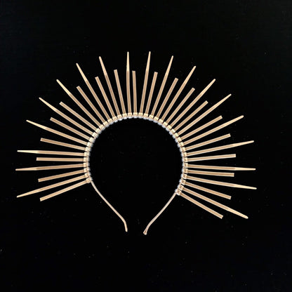 Sunburst halo crown in gold made of zipties.
