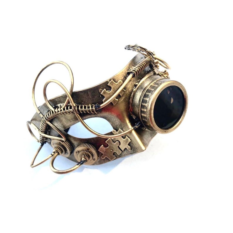 Unisex steampunk masquerade mask in gold with a goggle lens over the left eye.