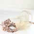rose gold metal mask with ivory feathers